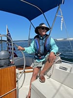 Photo of Dr. Watts on a boat.